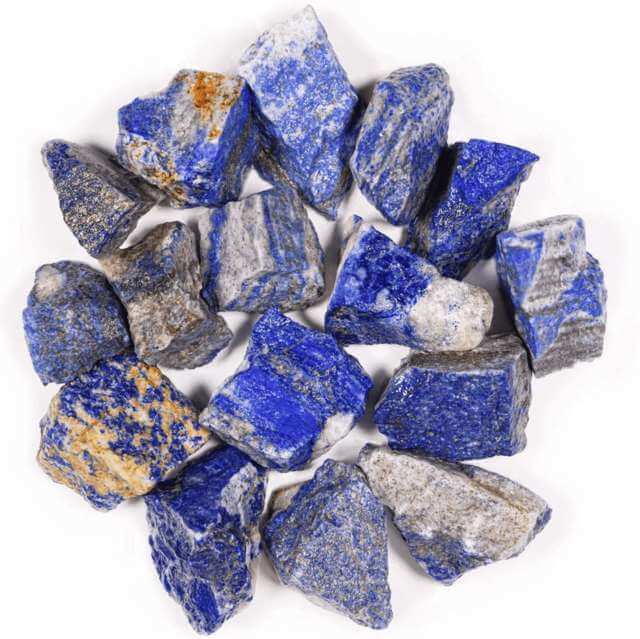 many pieces of raw unpolished blue rocks top close up view