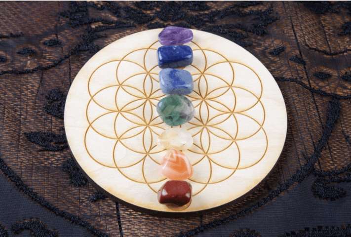 purple blue green white yellow red gem stones arranged in a circle grid