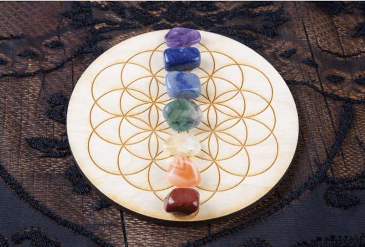 purple blue green white yellow red gem stones arranged in a circle grid