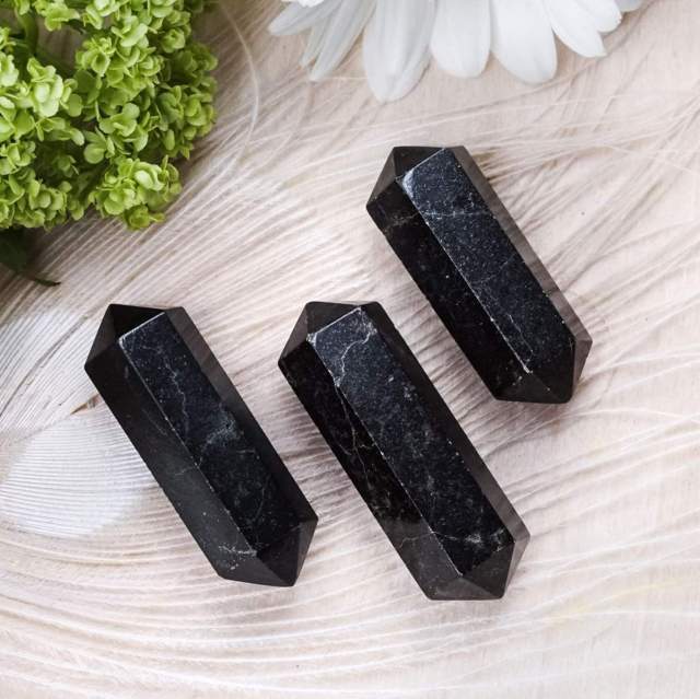 3 pieces of black tourmaline gems shapes into prism