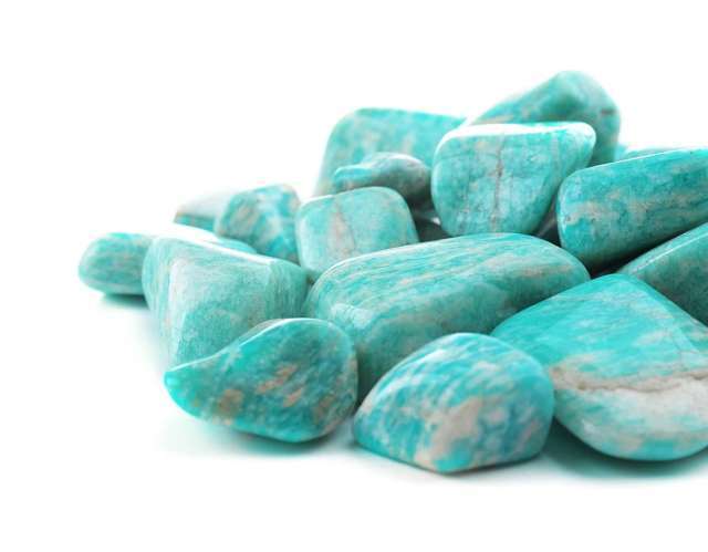 many pieces pile of smooth turquoise colored stones