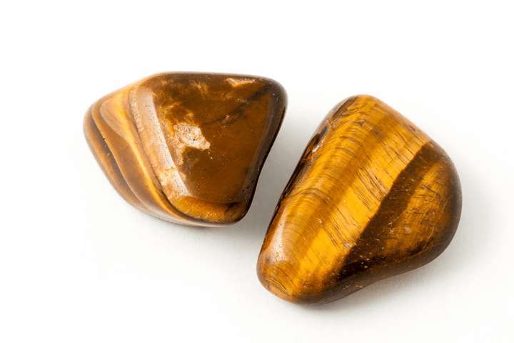 two pieces yellow smooth stones with brown pattern