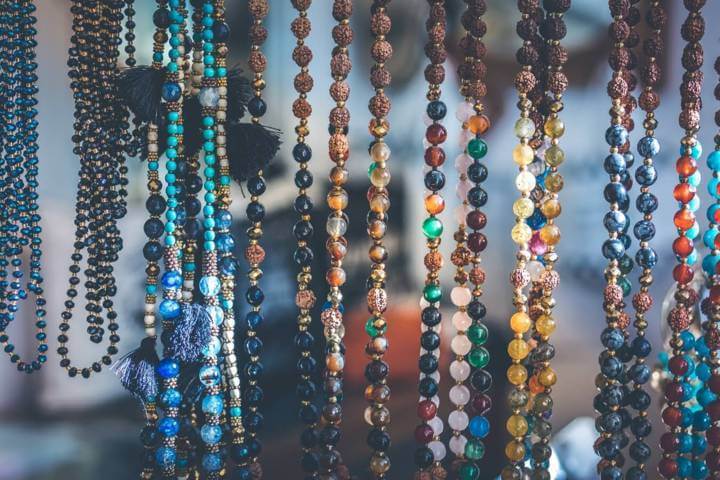 strand necklaces with different colored circle stone beads