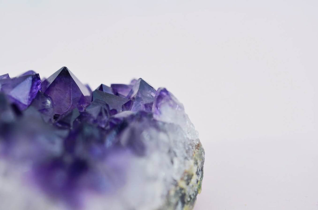 raw purple crystal rock close up view