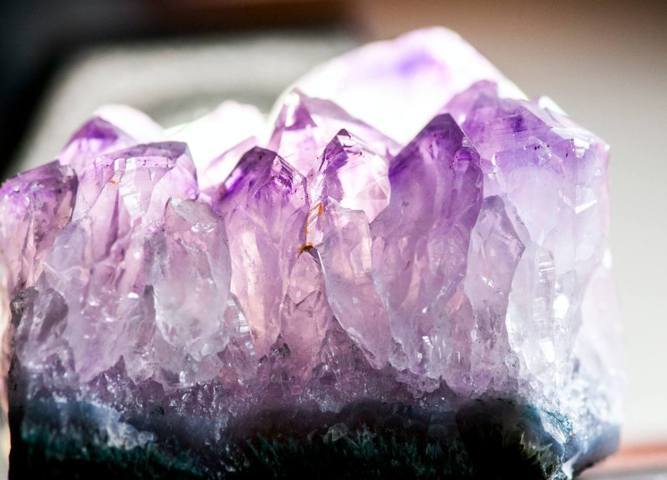 gradient purple color crystal rock unpolished close up view
