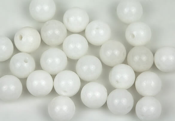 many pieces of smooth white circle stone beads