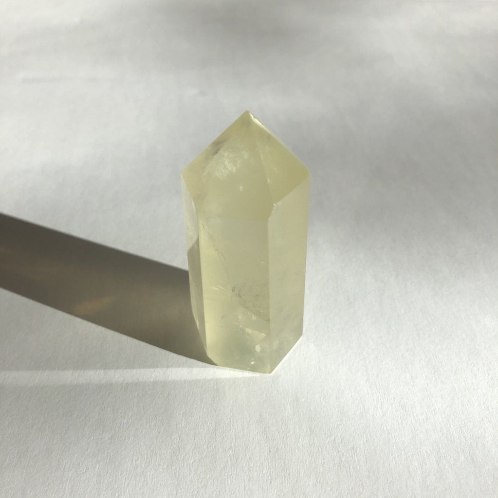 Citrine Point crystal on white background