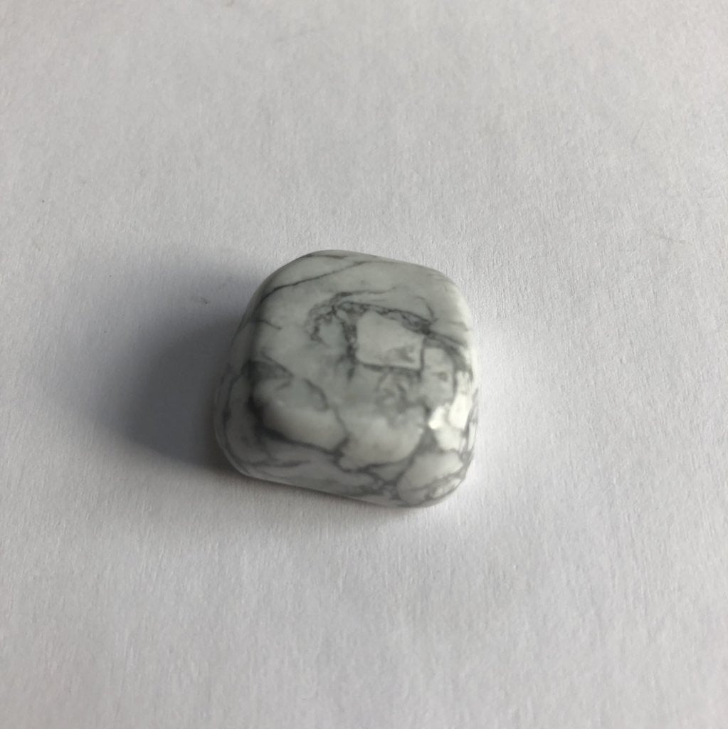 Howlite Tumbled crystal on white background