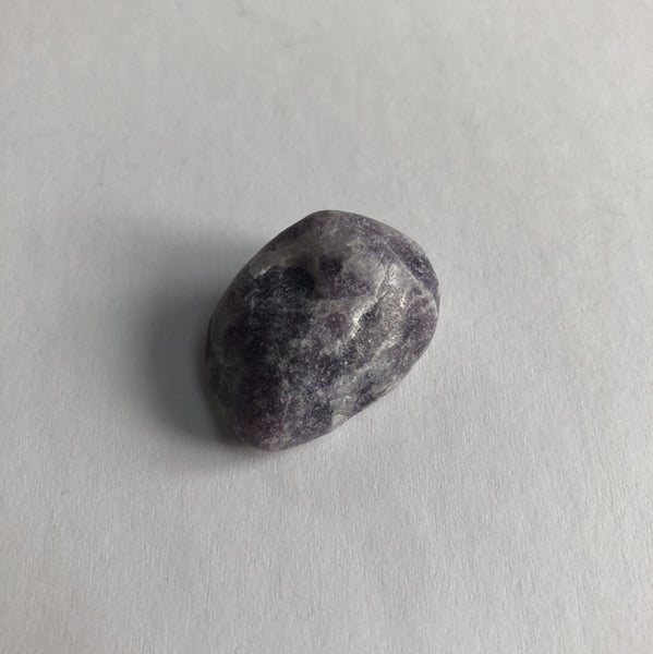 Lepidolite Tumbled crystal on white background