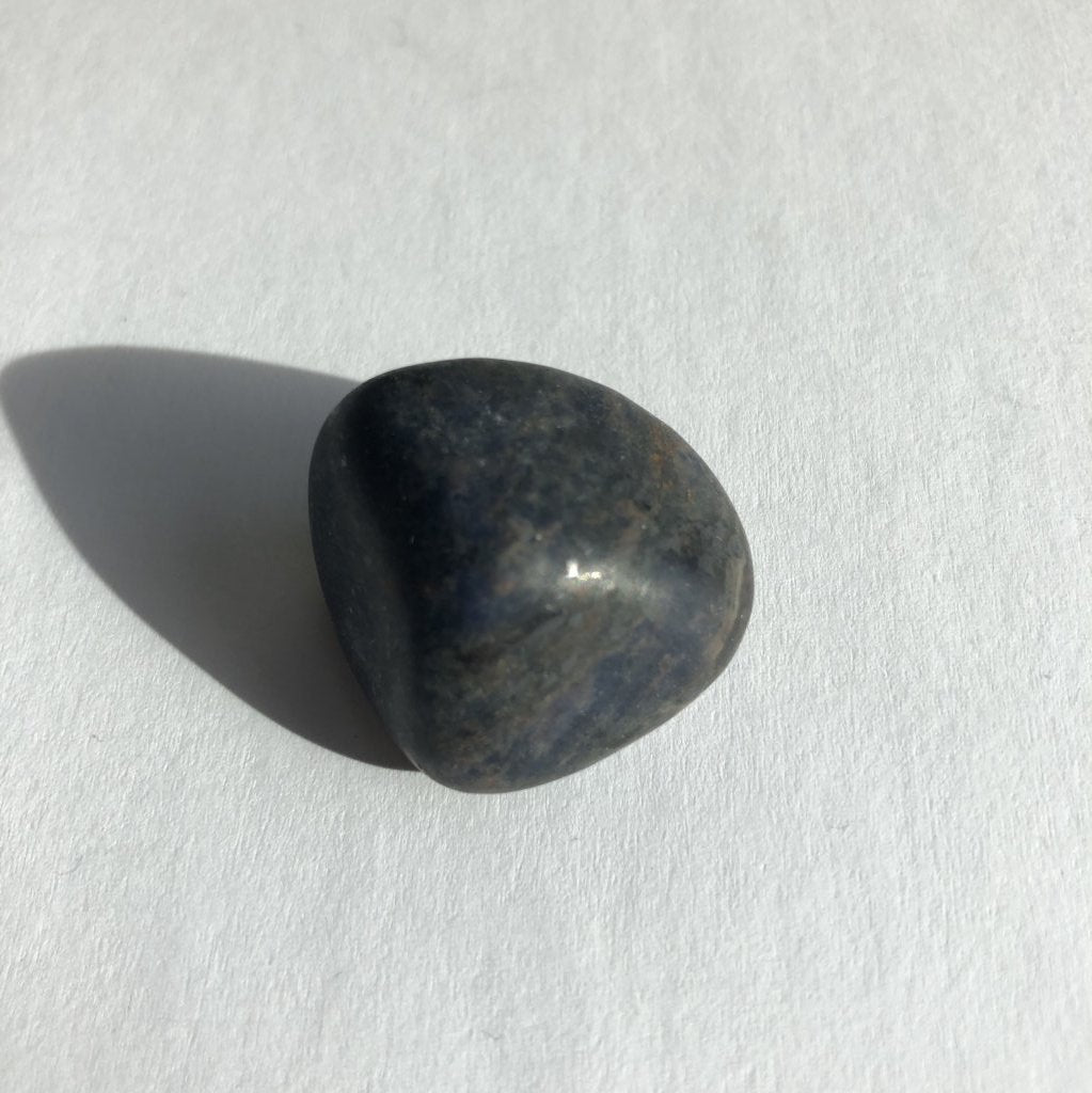 Sodalite Tumbled crystal on white background