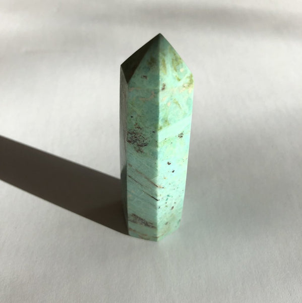 Turquoise Point crystal on white background